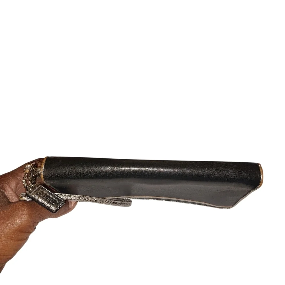 👜 Coach Black and Gold Poppy Clutch